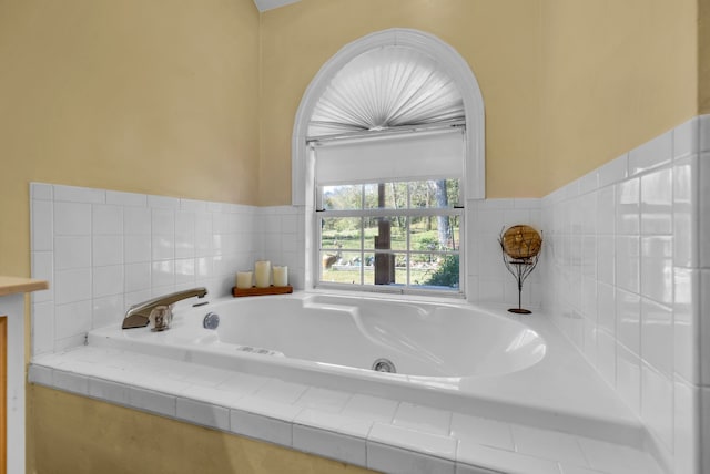 bathroom with tiled tub