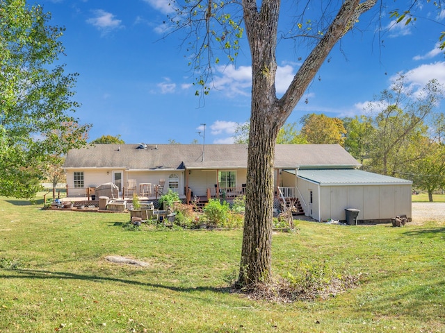 back of property featuring a lawn