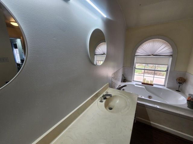 bathroom featuring a bath and sink