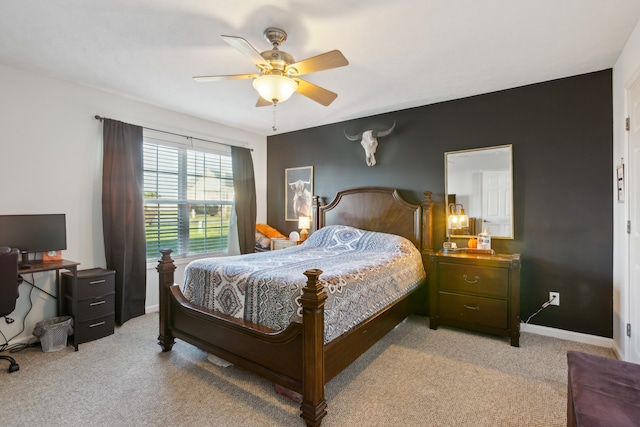 bedroom featuring light colored carpet and ceiling fan