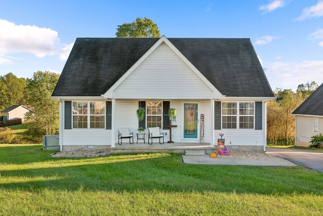 back of property featuring a yard