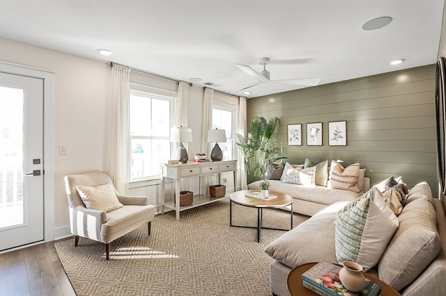 living room with hardwood / wood-style floors and ceiling fan