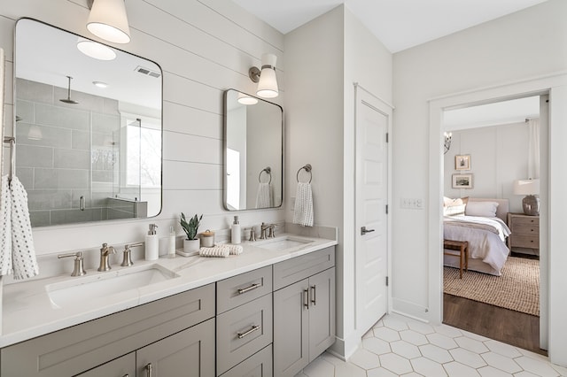 bathroom featuring a shower with door, hardwood / wood-style floors, and vanity