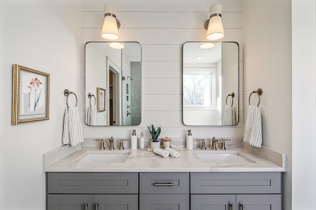 bathroom featuring vanity and a shower with shower door