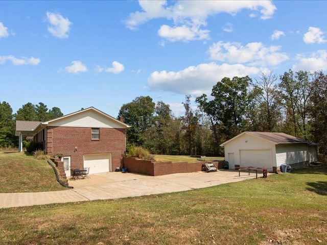 view of home's exterior featuring an outbuilding, a yard, and a garage