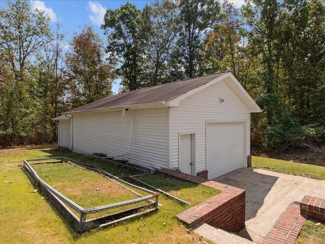 garage featuring a yard