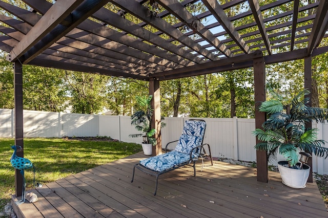 wooden deck with a yard and a pergola