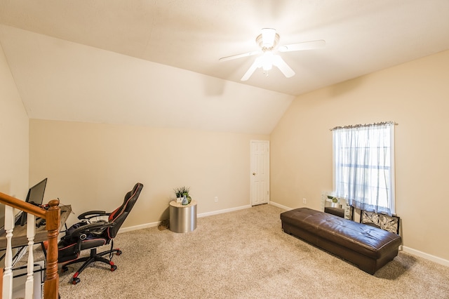 carpeted office featuring lofted ceiling and ceiling fan