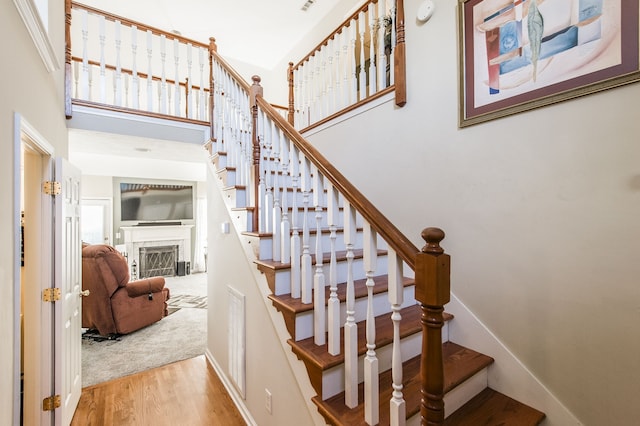 staircase with wood-type flooring