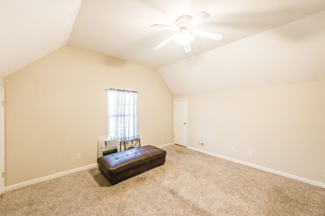 additional living space featuring ceiling fan, light colored carpet, and vaulted ceiling