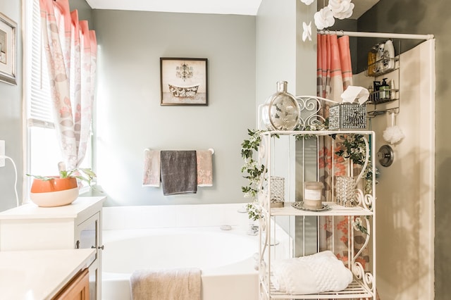 bathroom featuring a bath and vanity