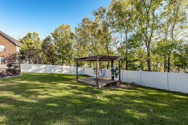 view of yard featuring a wooden deck and a pergola