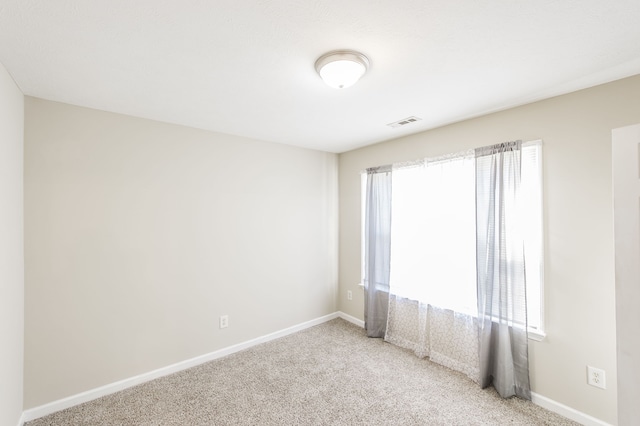 view of carpeted spare room