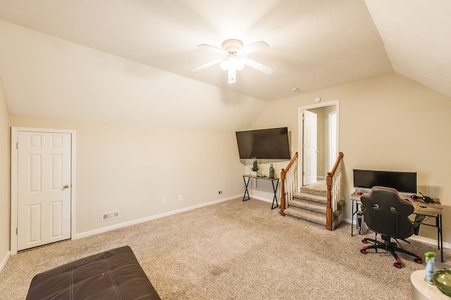 office space with light carpet, ceiling fan, and vaulted ceiling