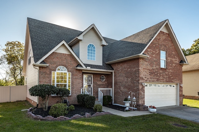 view of front property featuring a front lawn and a garage