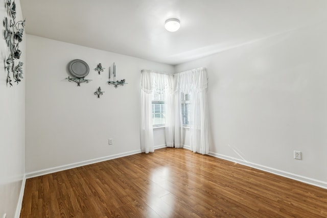 spare room featuring hardwood / wood-style floors