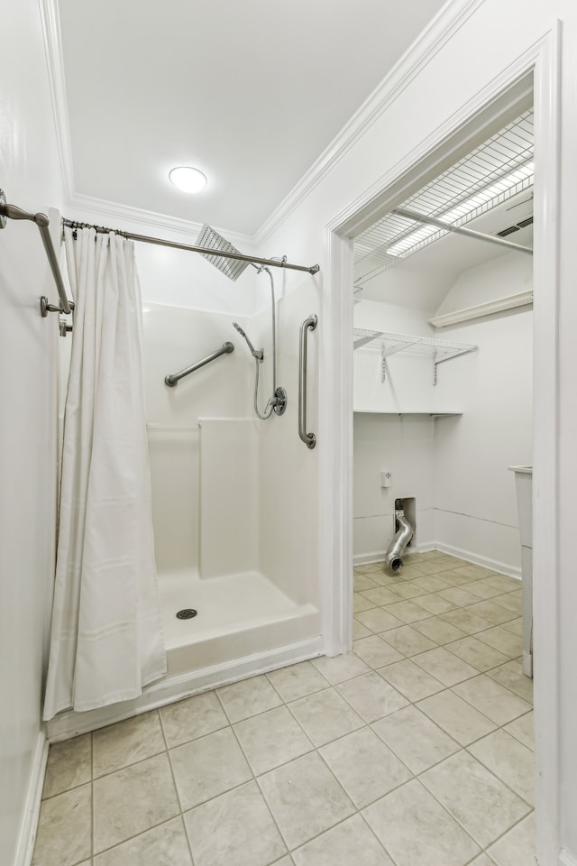 bathroom featuring crown molding, tile patterned floors, and walk in shower