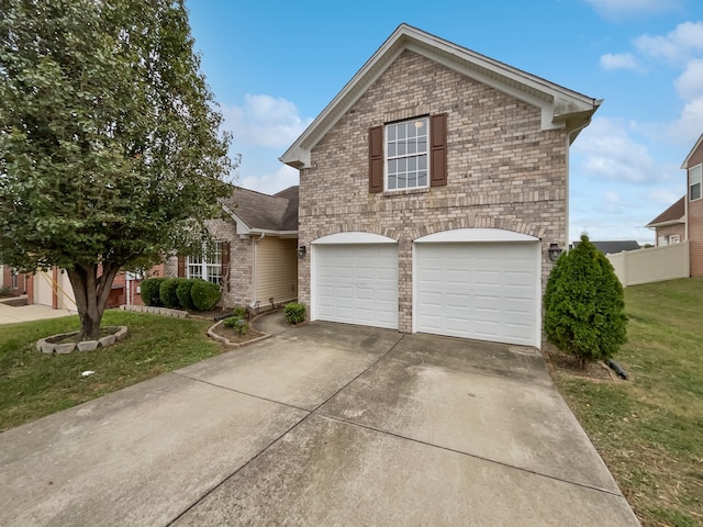 front facade with a front yard and a garage