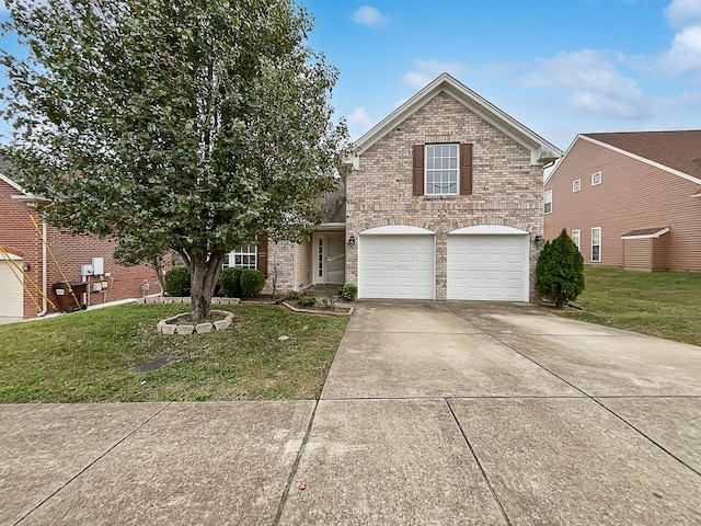 view of property featuring a front yard and a garage