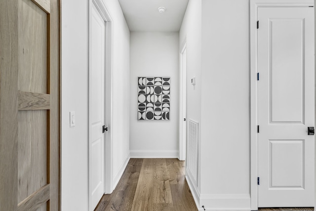 corridor with dark wood-type flooring