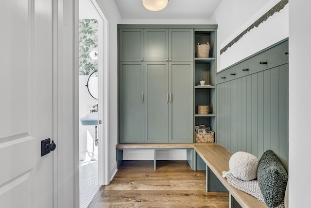 mudroom with light hardwood / wood-style floors