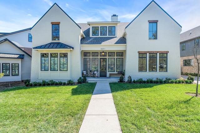 view of front of home with a front yard