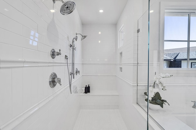 bathroom with sink and tiled shower