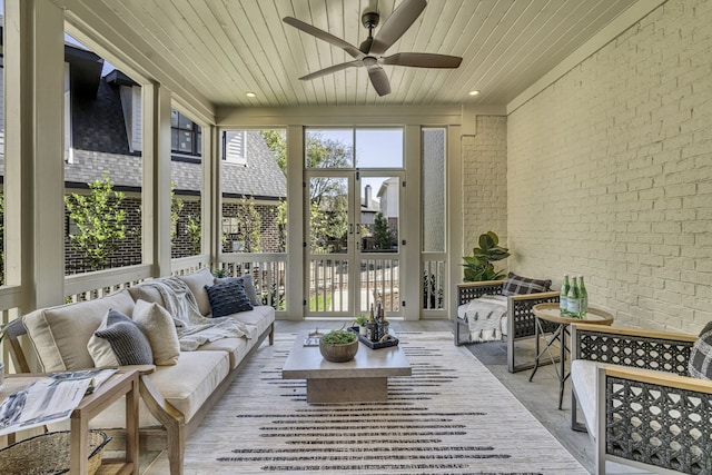 sunroom / solarium with ceiling fan and wood ceiling