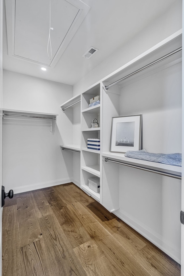 spacious closet featuring hardwood / wood-style floors