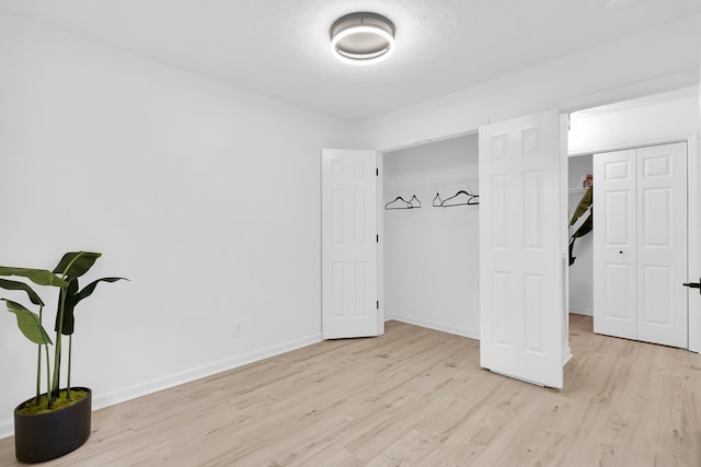 bedroom with light hardwood / wood-style floors