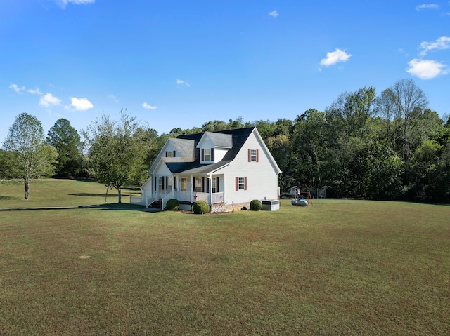 view of property exterior featuring a yard and covered porch