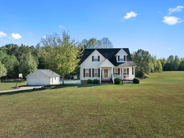 cape cod-style house with a porch, a front yard, an outbuilding, and a garage