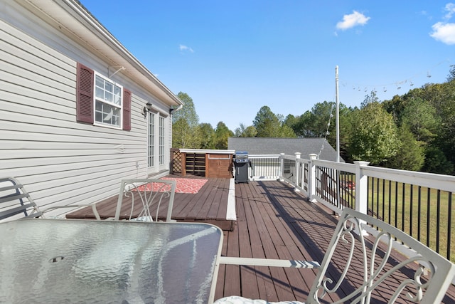 deck featuring a lawn