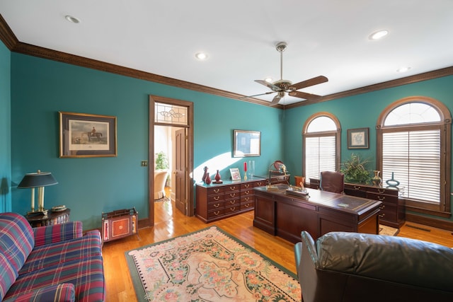 office area with crown molding, light wood-type flooring, and ceiling fan