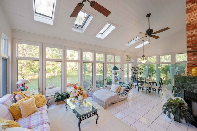 sunroom / solarium featuring ceiling fan, a healthy amount of sunlight, and lofted ceiling