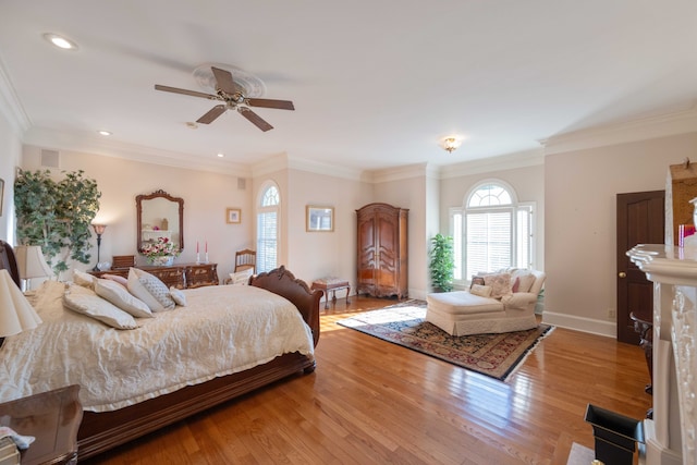 bedroom featuring ornamental molding, light hardwood / wood-style flooring, and ceiling fan