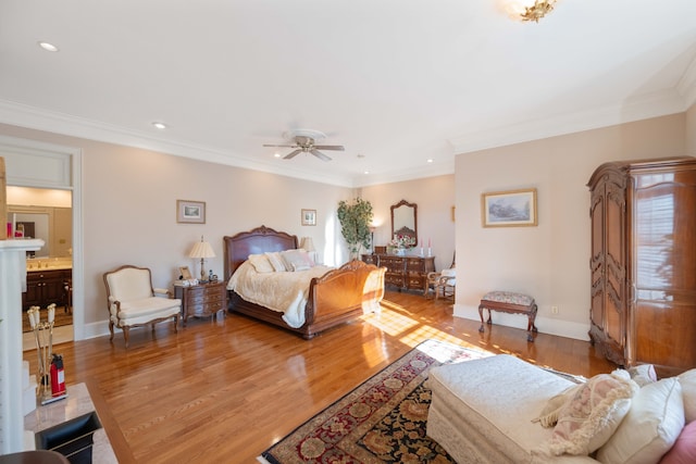 bedroom with ornamental molding, ensuite bath, wood-type flooring, and ceiling fan