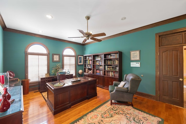 office with crown molding, light hardwood / wood-style flooring, and ceiling fan