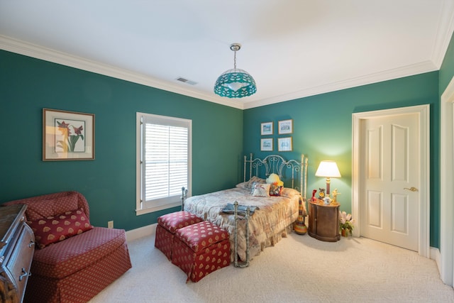 carpeted bedroom featuring crown molding