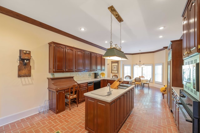 kitchen with tasteful backsplash, oven, a kitchen island, decorative light fixtures, and ornamental molding