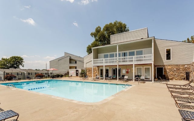 view of swimming pool featuring a patio area