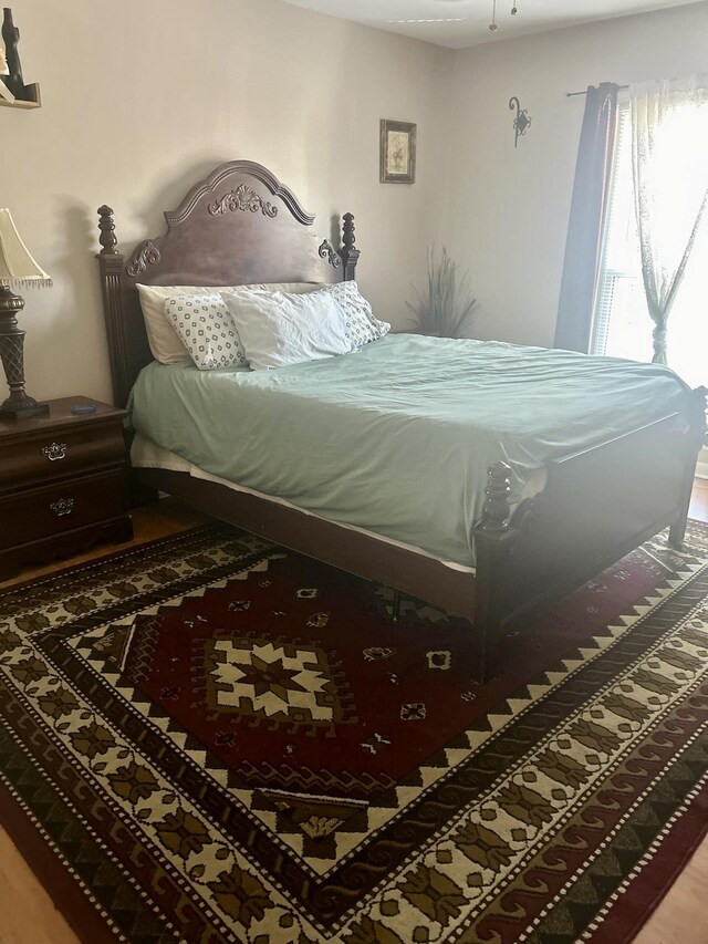 bedroom with wood finished floors