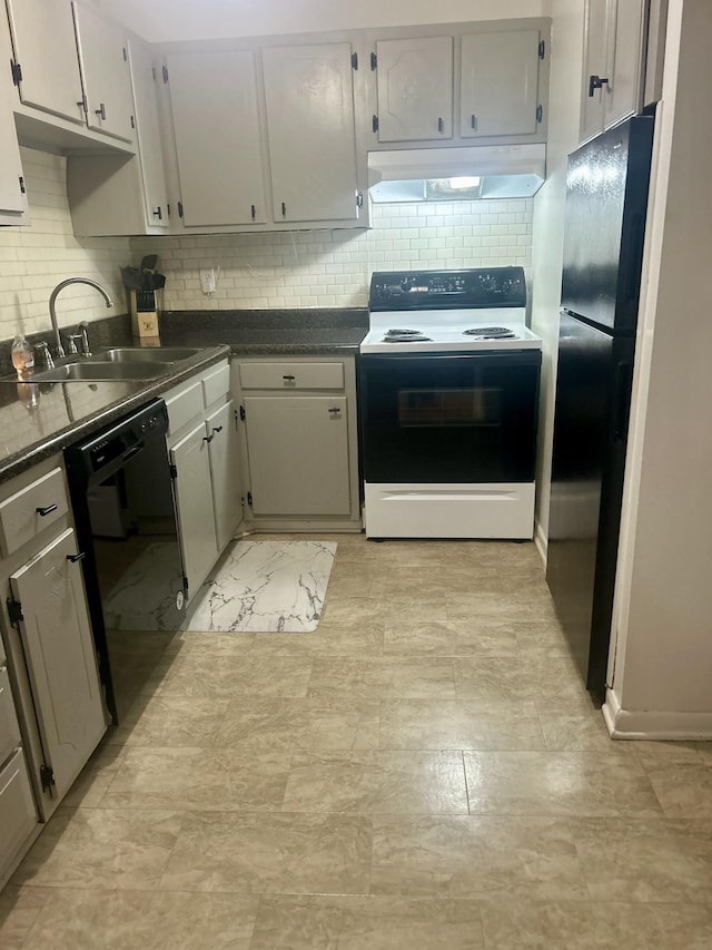 kitchen featuring a sink, tasteful backsplash, dark countertops, under cabinet range hood, and black appliances