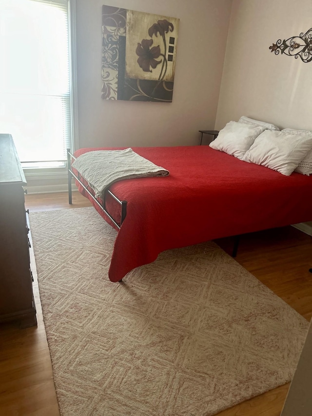 bedroom featuring wood finished floors