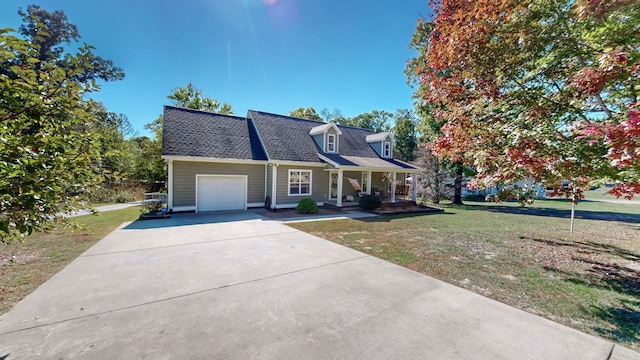 cape cod house with a garage, a front lawn, and a porch