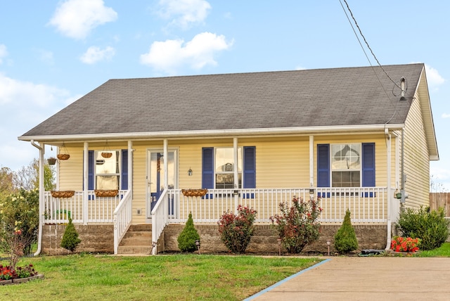 view of front of home featuring a porch and a front yard