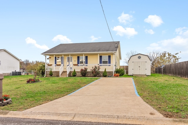 bungalow-style home featuring a shed, a front lawn, and a porch