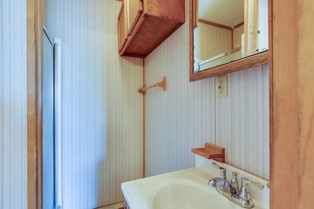 bathroom featuring vanity and a textured ceiling