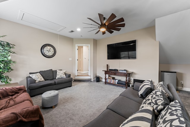 carpeted living room with ceiling fan