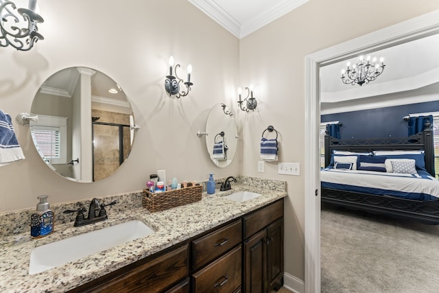 bathroom with vanity, crown molding, and a shower with door